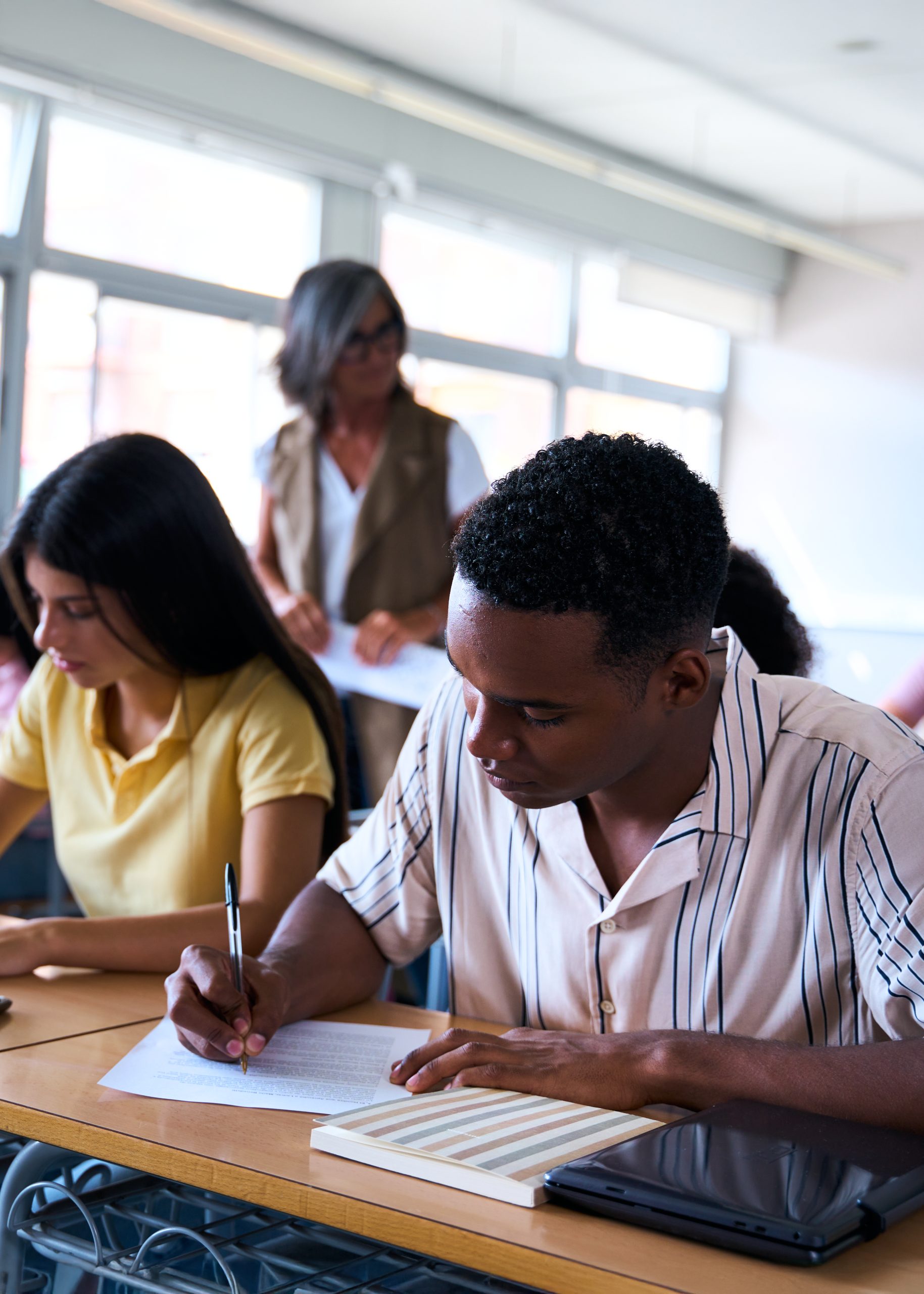 Students taking practice exams in ISAL classroom