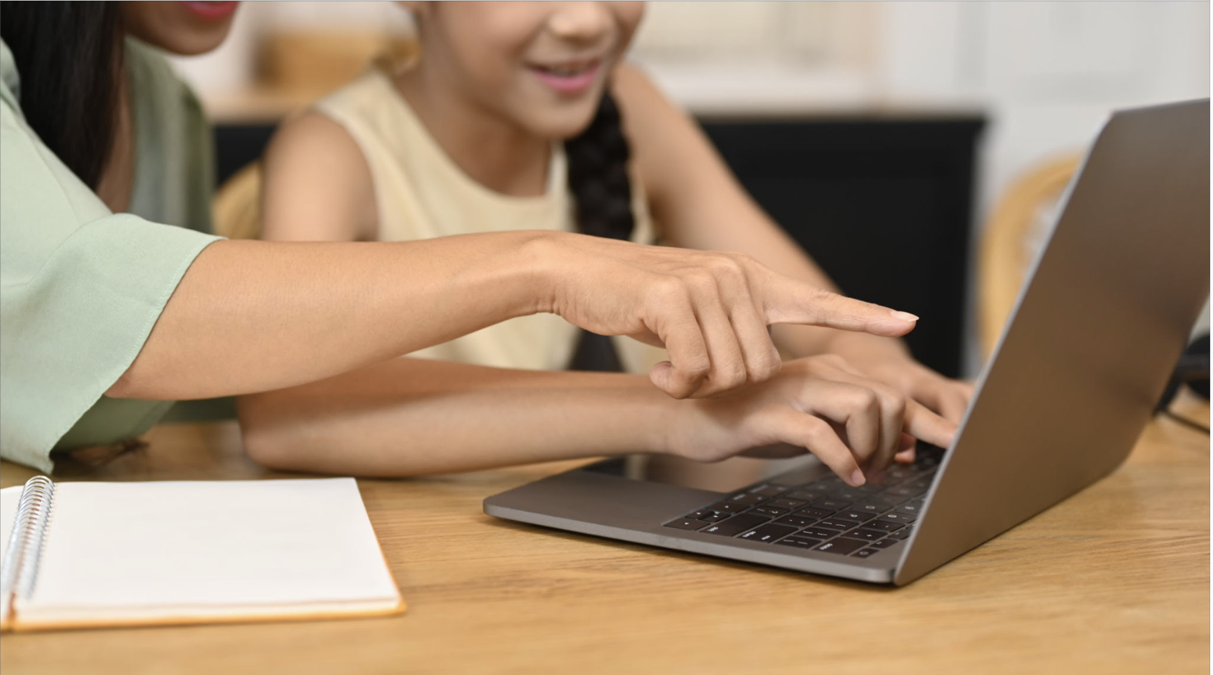 Teacher guiding student online during English lesson